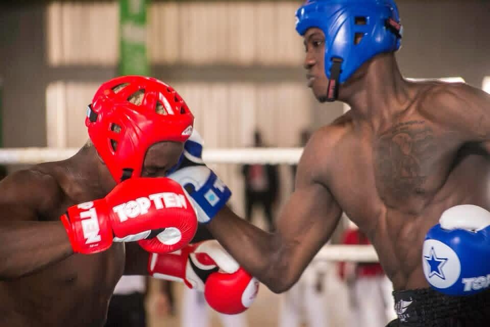 Two kickboxers competing in the ring